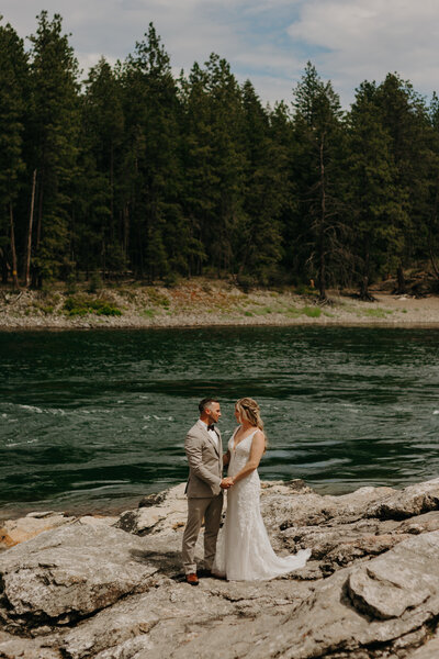 couple kisses in forest