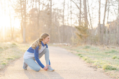 fitness coach tying her shoes during branding pictures in Chantilly,Virginia