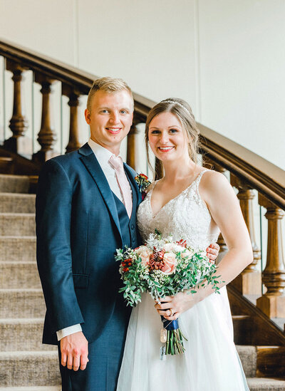 groom kissing bride at Nebraska State Capital