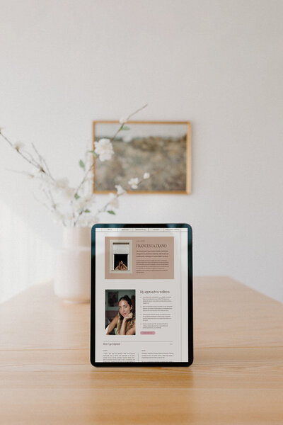 iPad mockup displaying a thoughtfully designed website for a yoga teacher and nutritionist, ideal for wellness entrepreneurs seeking a fresh, easy-to-navigate, and visually calming online space for their business.