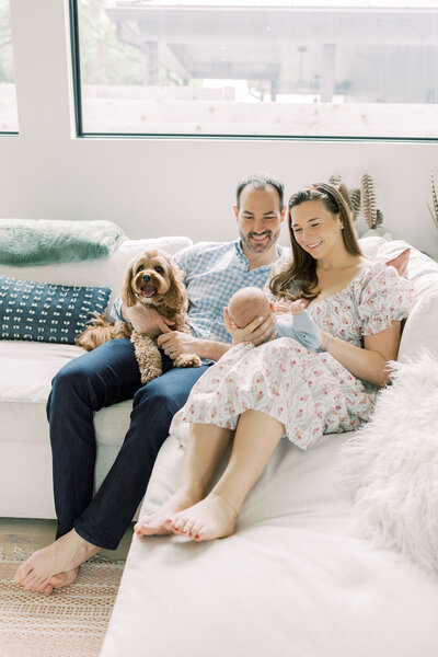 Couple holds an ultrasound during an indoor maternity session.