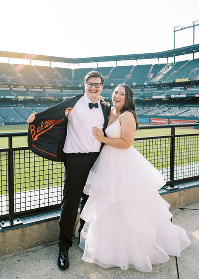 Katie Fri and her husband on their wedding day at Camden Yards, Baltimore, MD