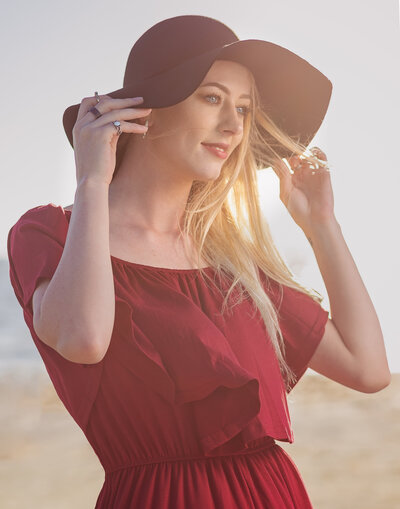 lady in pink dress with black hat