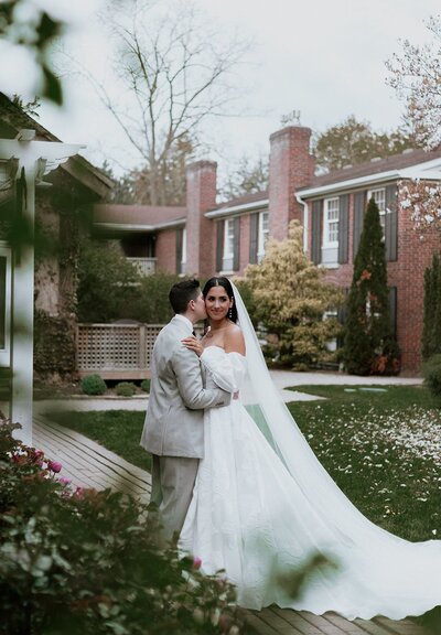 Brides kissing outside elegant venue