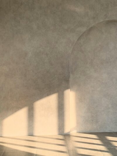 Calming neutral and sunlit interior with shadows