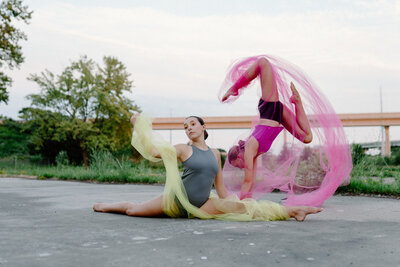 acro dancers doing a pose together on stage at thunderstruck