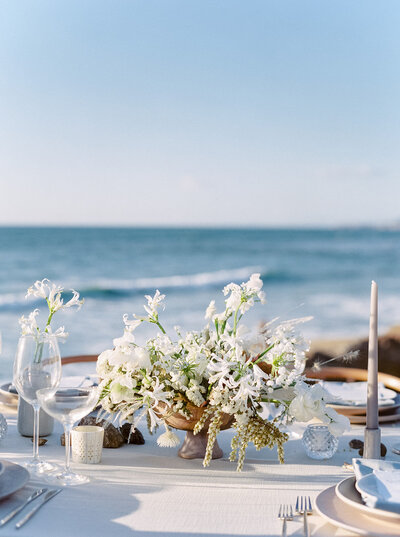 Editorial table setup on the beach, blending refined detail with natural scenery, perfect for Destination Wedding Photographer Seattle DC.