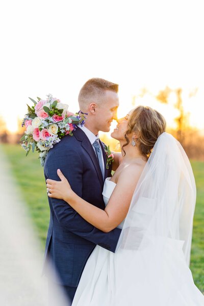Bride and groom kiss at chateau selah venue blountville wedding photographer