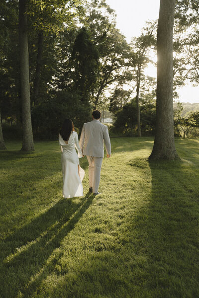 Couples are walking while holding hands rehearsing for their wedding day