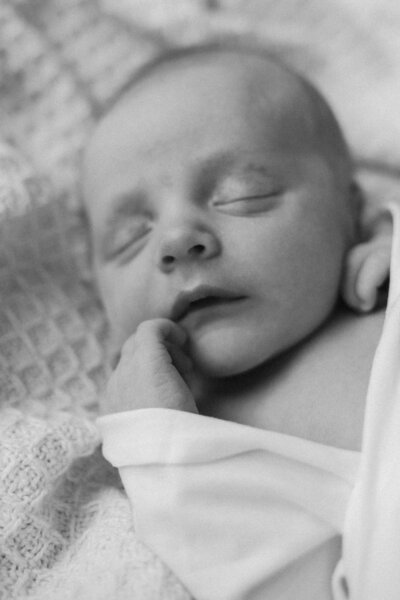 Black and white image of a newborn baby