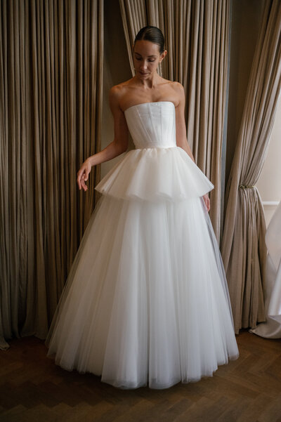 black and white image bride wearing feathered wedding dress