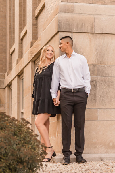 Fiances holding hands during engagement photo session.