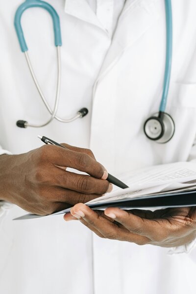 Medical professional writing Thermage treatment notes demonstrating RN expertise for med spa content creation