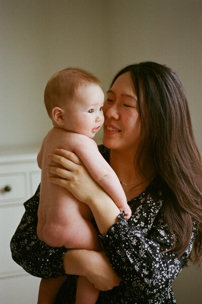 A mom and baby at home photographed on film in Pickering Ontario.