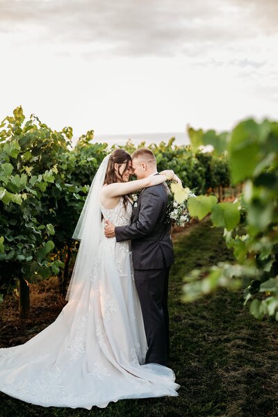Louisville Kentucky wedding photographer captures vineyard wedding portraits at Huber’s Orchard & Winery.
