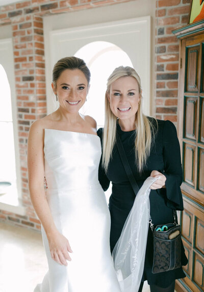 Natasha Kozlowski, luxury wedding planner in Austin and New Orleans, standing with bride