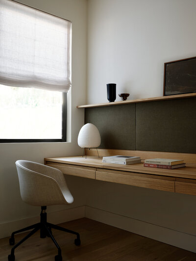 home-office-interior-design-oak-desk-fabric-green-pinboard-menu-chair-noguchi-lamp-linen-roman-shade-austin-house-franc