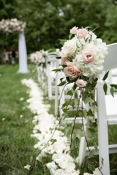 Floral aisle markers for outdoor wedding ceremony at The Connors Center