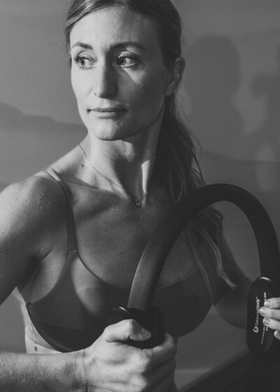 Two women on Pilates reformers