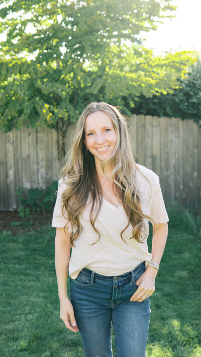 Portrait of Ashlyn Taulbee, Portland Family and lifestyle photographer, standing outdoors in natural light