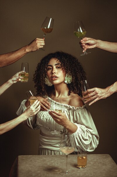 Portrait, Beautiful Detail, White off the shoulder top, Curly Hair, Wine Glasses, Neutral Background