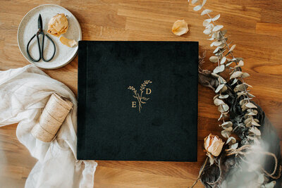 black velvet wedding album with gold text