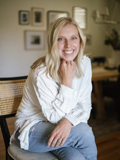 Professional portrait of Kaitlyn Schultz in a cozy, light-filled space.