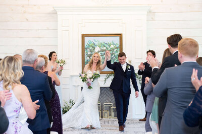 Ottawa wedding photography of a bride and groom  kissing along a rustic fence at Stonefields Estate taken by Ottawa wedding photographer JEMMAN Photography