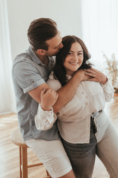 A couple in an all white natural light Carson City studio.