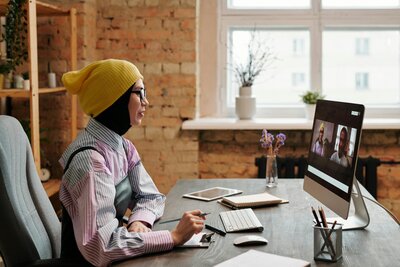 Image of a patient attending a zoom call meeting for the Optune Support Hub