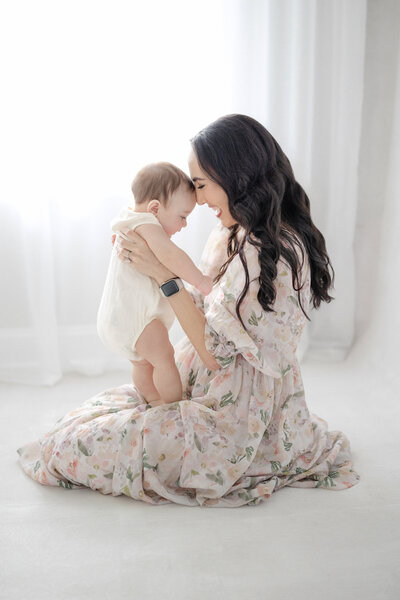 Timeless Tampa motherhood lifestyle session: mother holding baby in Tampa studio