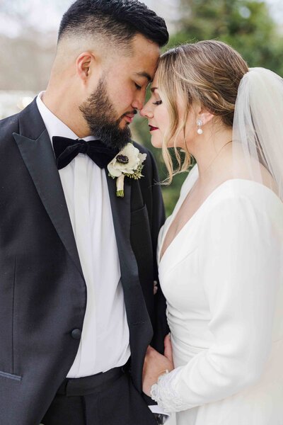 wedding couple touching foreheads