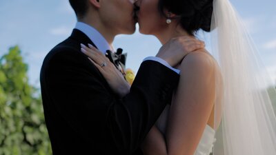 bride and groom holding eachother