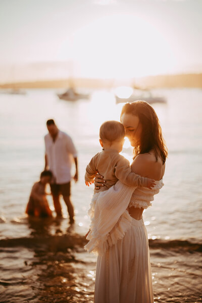 Parents and children walking together at golden hour, taken by Sydney family photographer Sophie Lea.
