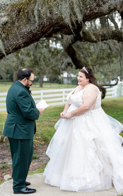 Gorgeous bride and groom first look under a canopy of trees in Savannah