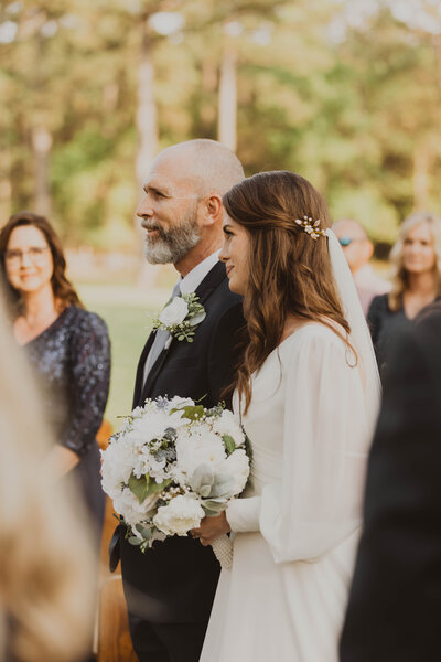 bride and dad walking down isle