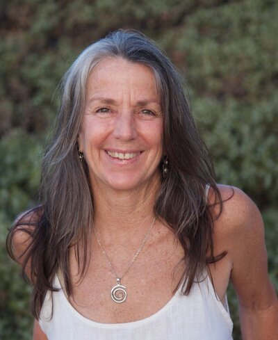 Peggy Profant, C-IAYT, E-RYT 500, guiding students at a 200 hour yoga teacher training retreat with playful and therapeutic expertise.