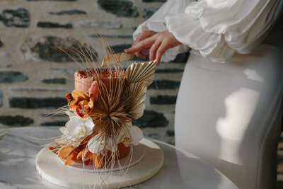 The Lovers Elopement Co - bride cuts wedding cake - catering organised for elopements