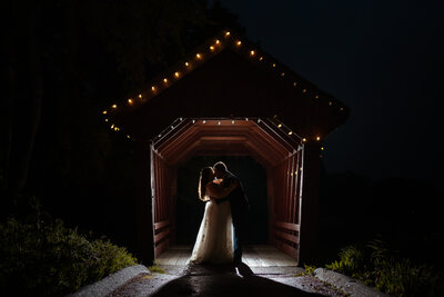 Creative night photography at covered bridge at the Farmhouse at Candia Woods by NH wedding photographer Lisa Smith Photography