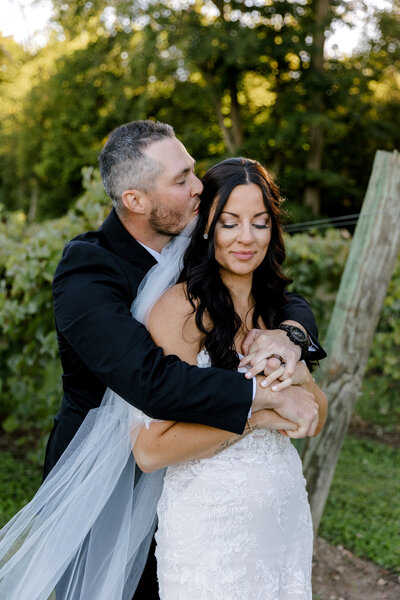 bride and groom hugging in the vineyard Lindsay Elaine Photography