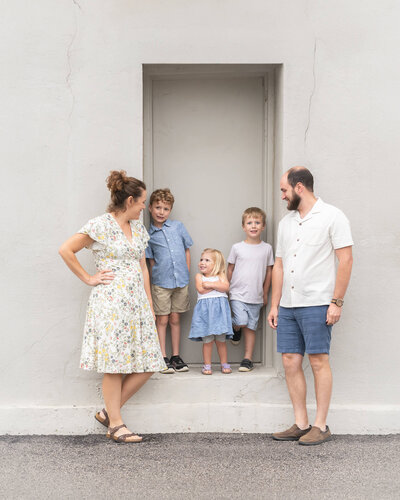 Beautiful family with 2 small boys and toddler girl outdoors in the springtime