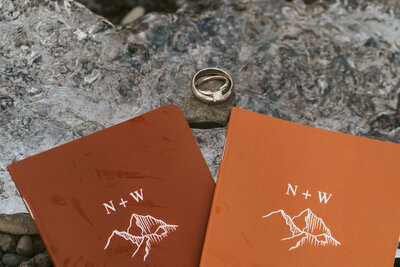 elopement couples on an piece of glacier ice at the Jokulsarlon iceberg Lagoon in Iceland