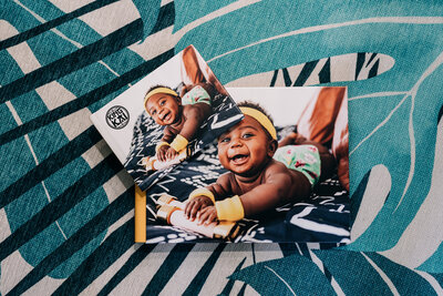 Young boy laughing joyfully on the cover of an album. 