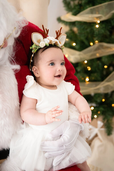 Toddler in festive outfit captured during Melbourne Christmas mini photography session