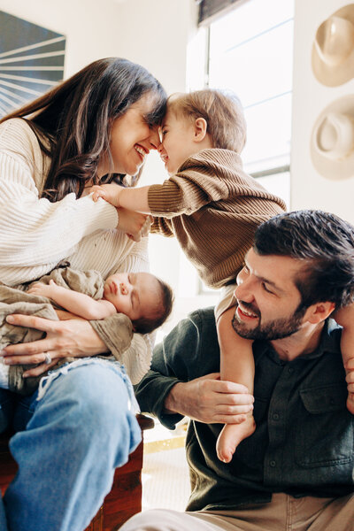 family of 3 with baby in the middle taken by a professional photographer