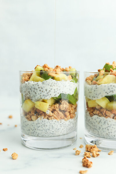 a chia pudding parfait with fresh pineapple, kiwi, and granola