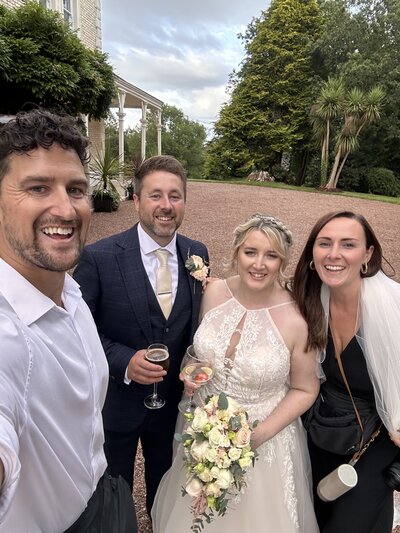 Amy & Nick posing with couple