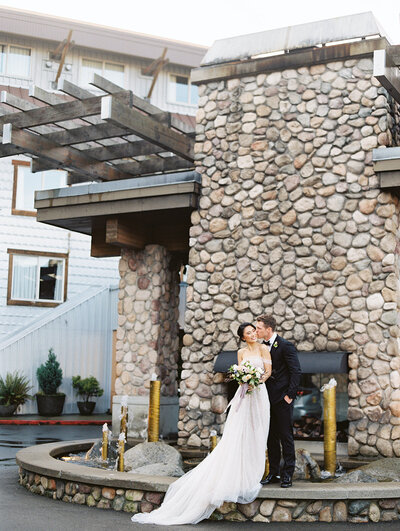 bride and groom outside the edgewater seattle