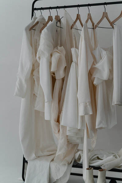 Clothing rack full of A.B. Ellie bridal pieces for their brand shoot