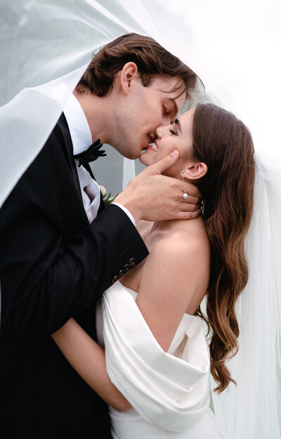 Bride and groom kissing